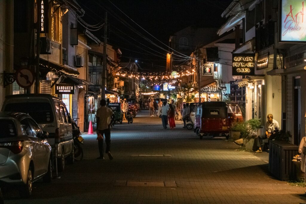 Pedlar Street inside Galle Fort lit by strings of lights at night