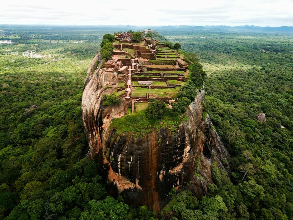 The Lion Rock at Sigiriya rising from open grassland
